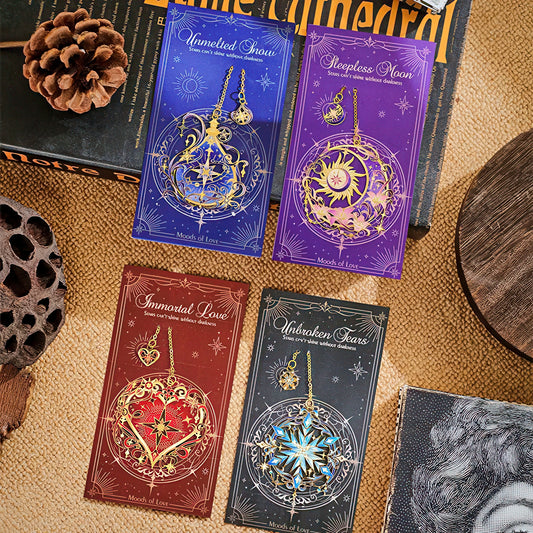 Set of four intricate floral and stars themed metal bookmarks