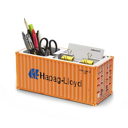 Orange container shaped pen holder with office supplies on a white background