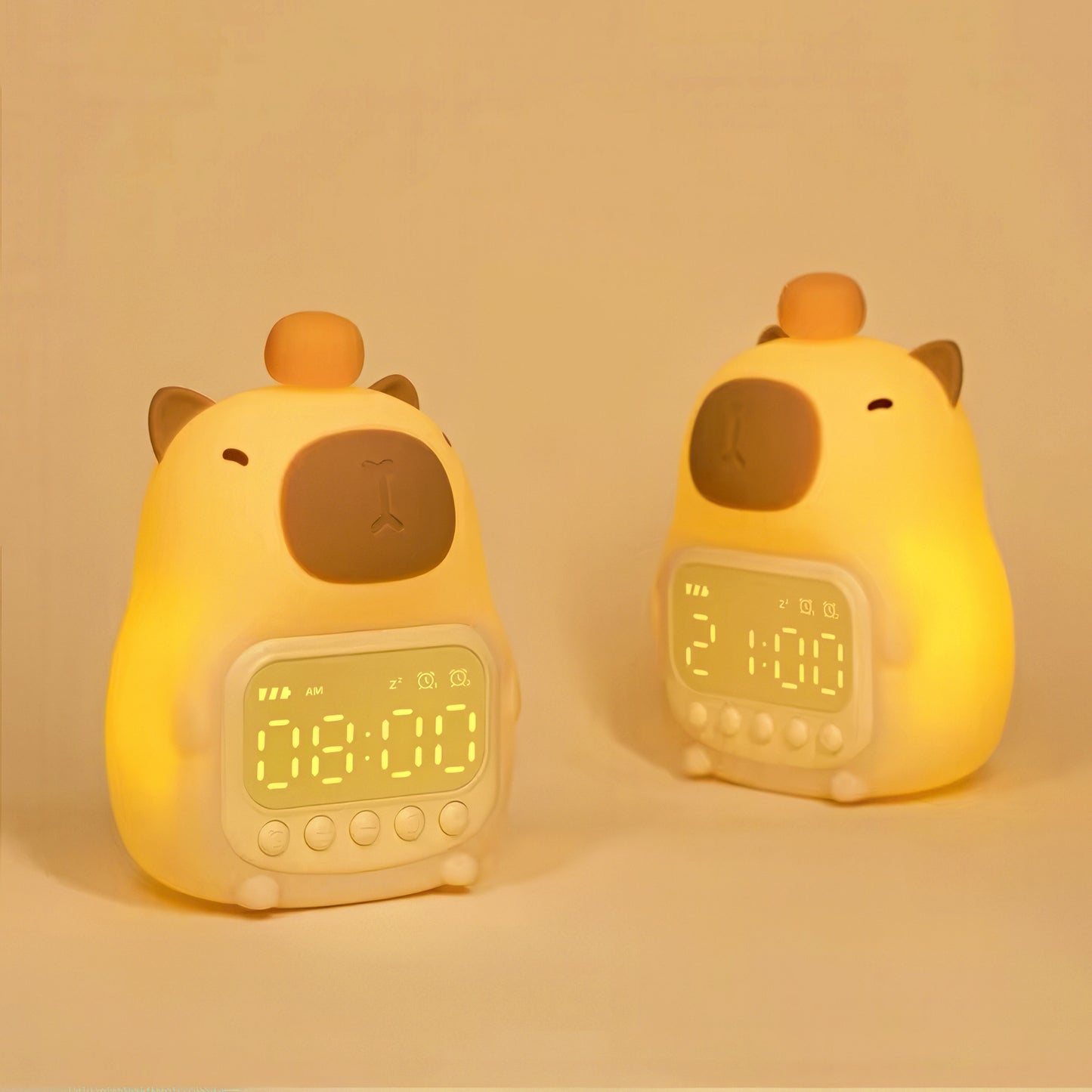 Two yellow cabybara-shaped alarm clocks on a beige background
