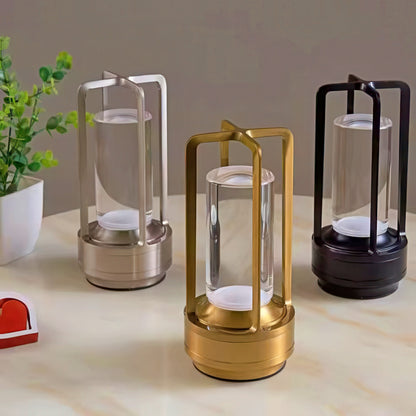 Three lanterns in gold, silver, and black on a light surface background.