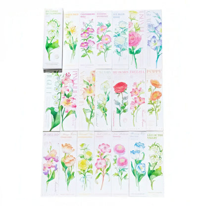 Set of paper bookmarks with various flower designs on a white background