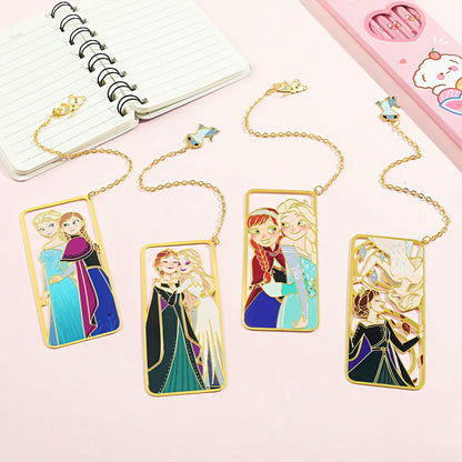 Set of four metal bookmarks with Frozen character illustrations on a pink surface.