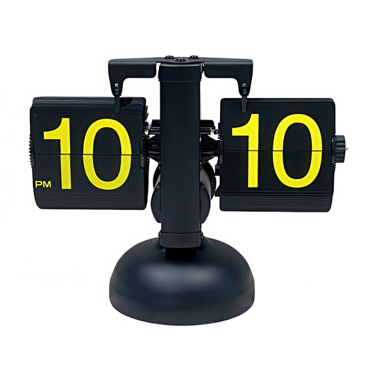 Black flip clock with yellow numbers on a white background