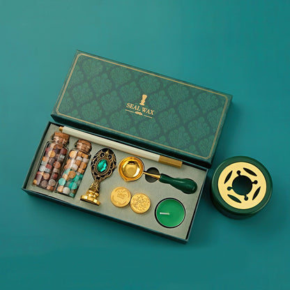 Seal wax kit with various components on a teal background