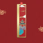 Decorative bookmark with traditional design on a red background