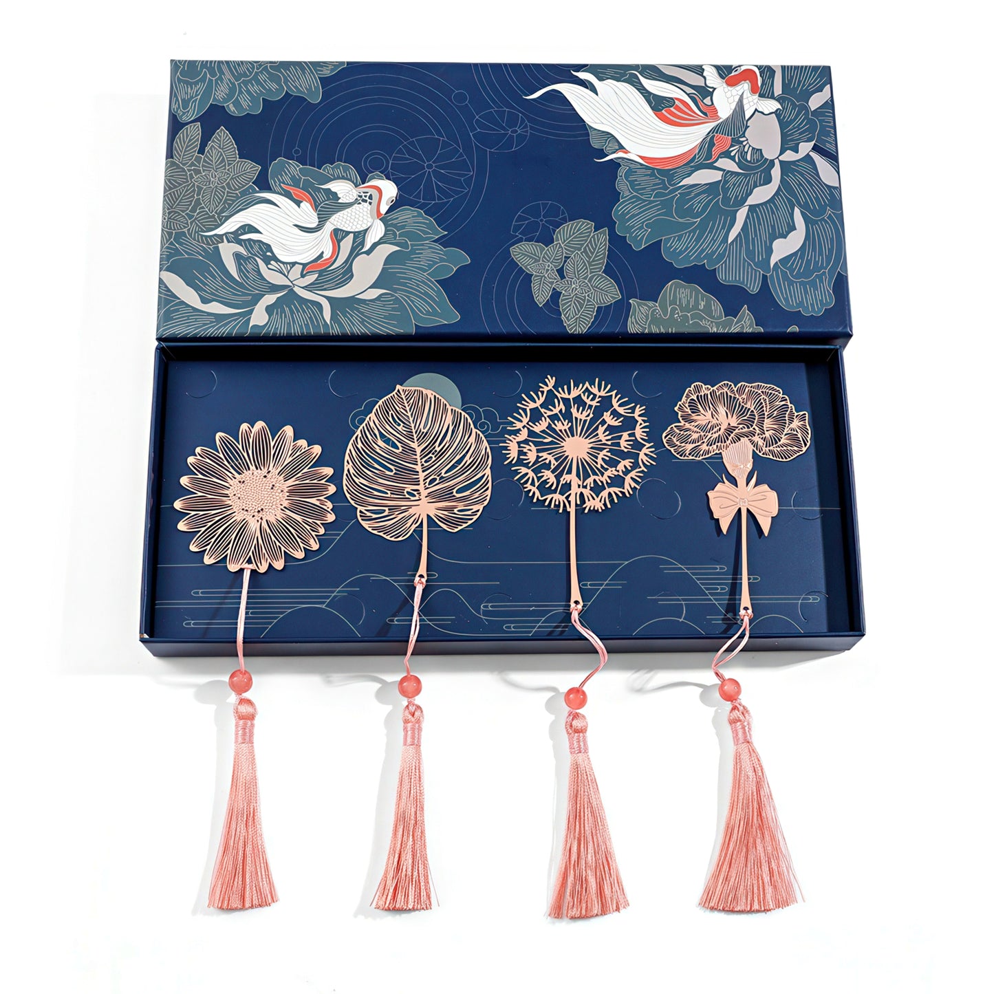 Metal bookmark with floral designs and tassels in a blue box.