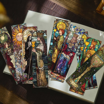 Colorful tarot bookmarks with intricate designs on a wooden surface