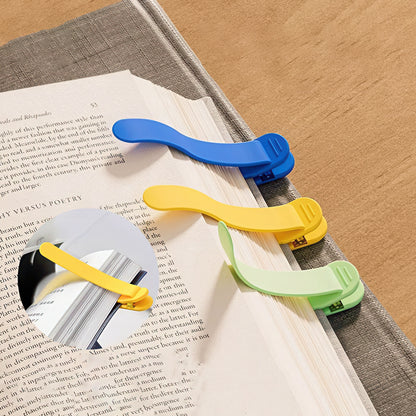 Colorful bookmarks on an open book with a textured surface