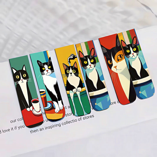 Set of colorful cat-themed bookmarks on a white surface