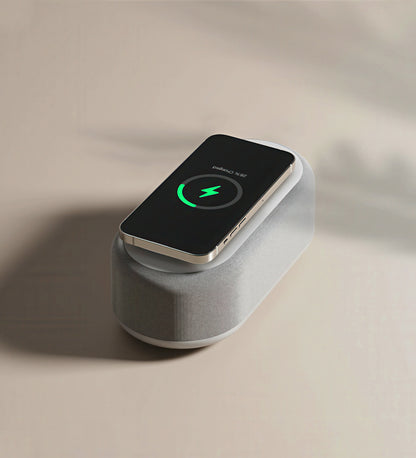 Wireless charging pad with a smartphone on a beige background