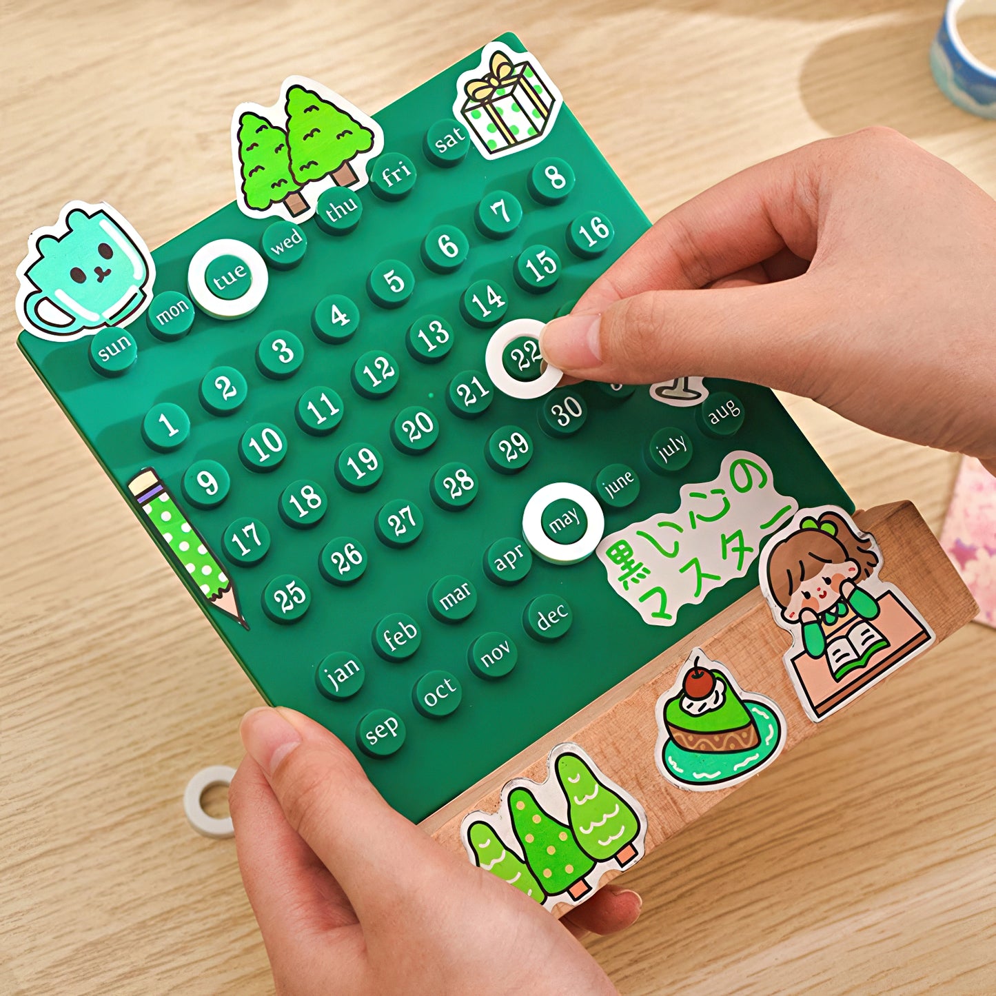 Calendar with stickers on a wooden surface