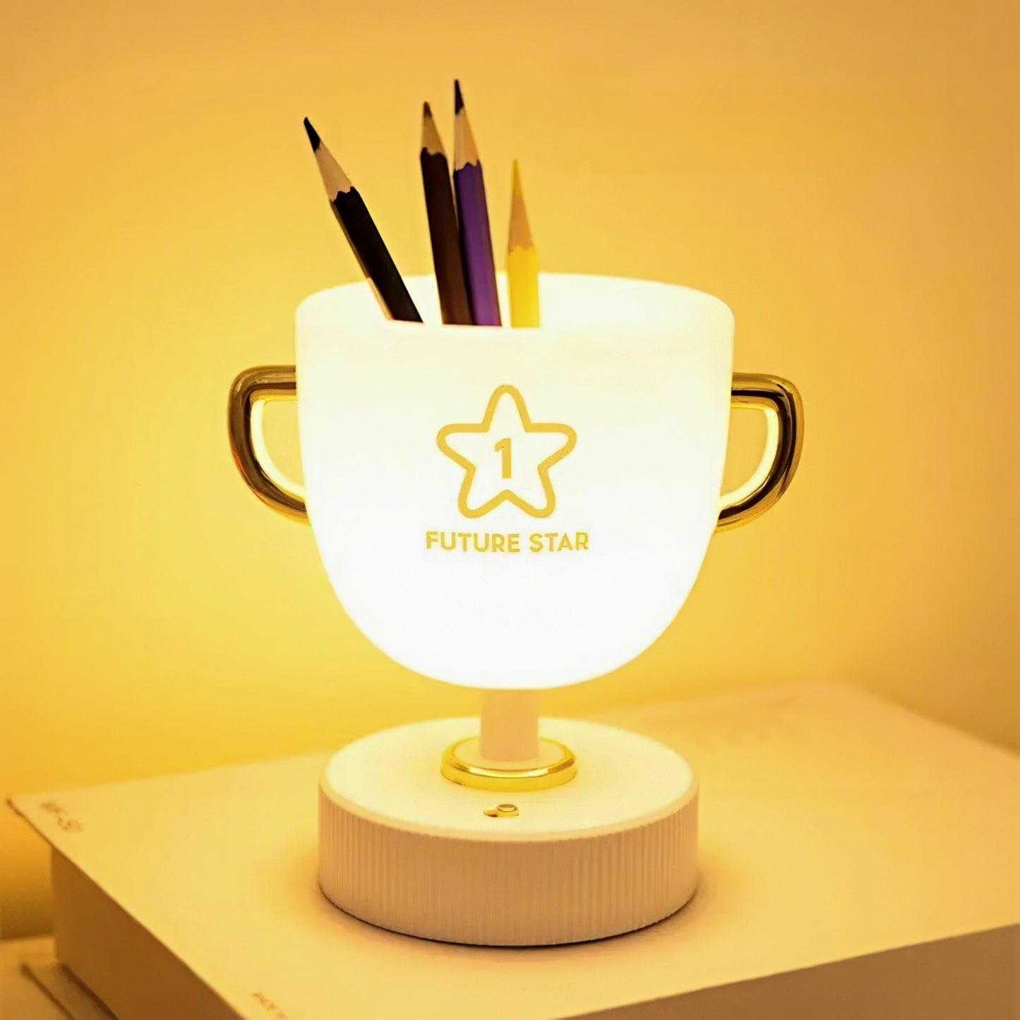 Decorative lamp with pen holder on a yellow background