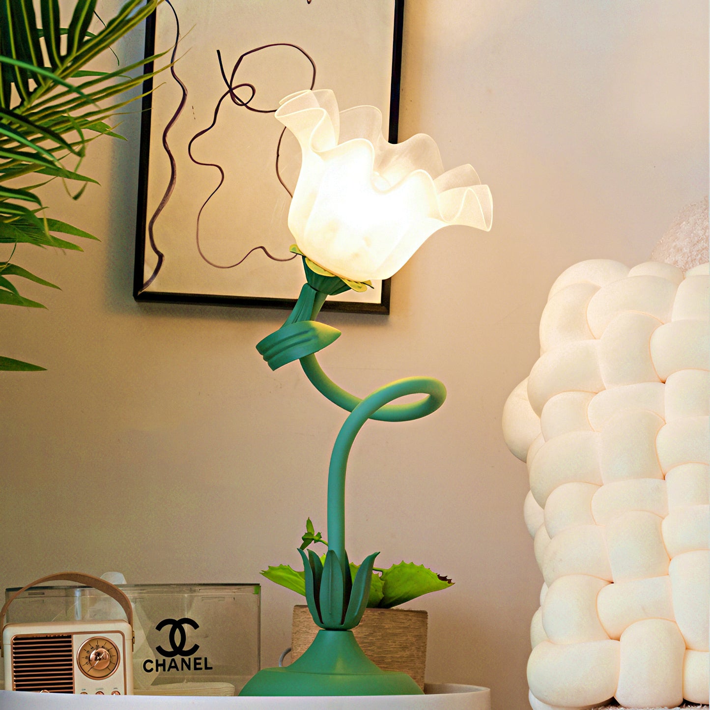 Decorative lamp shaped like a flower on a table.