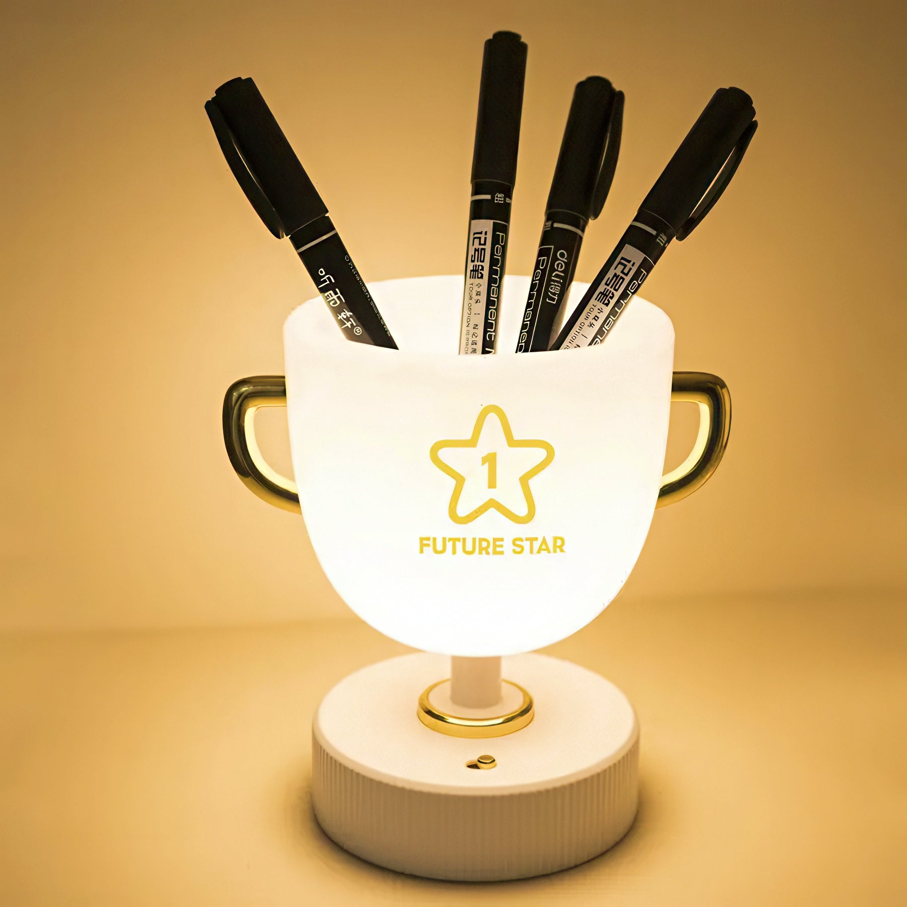 Trophy cup lamp with pen holder on a warm background