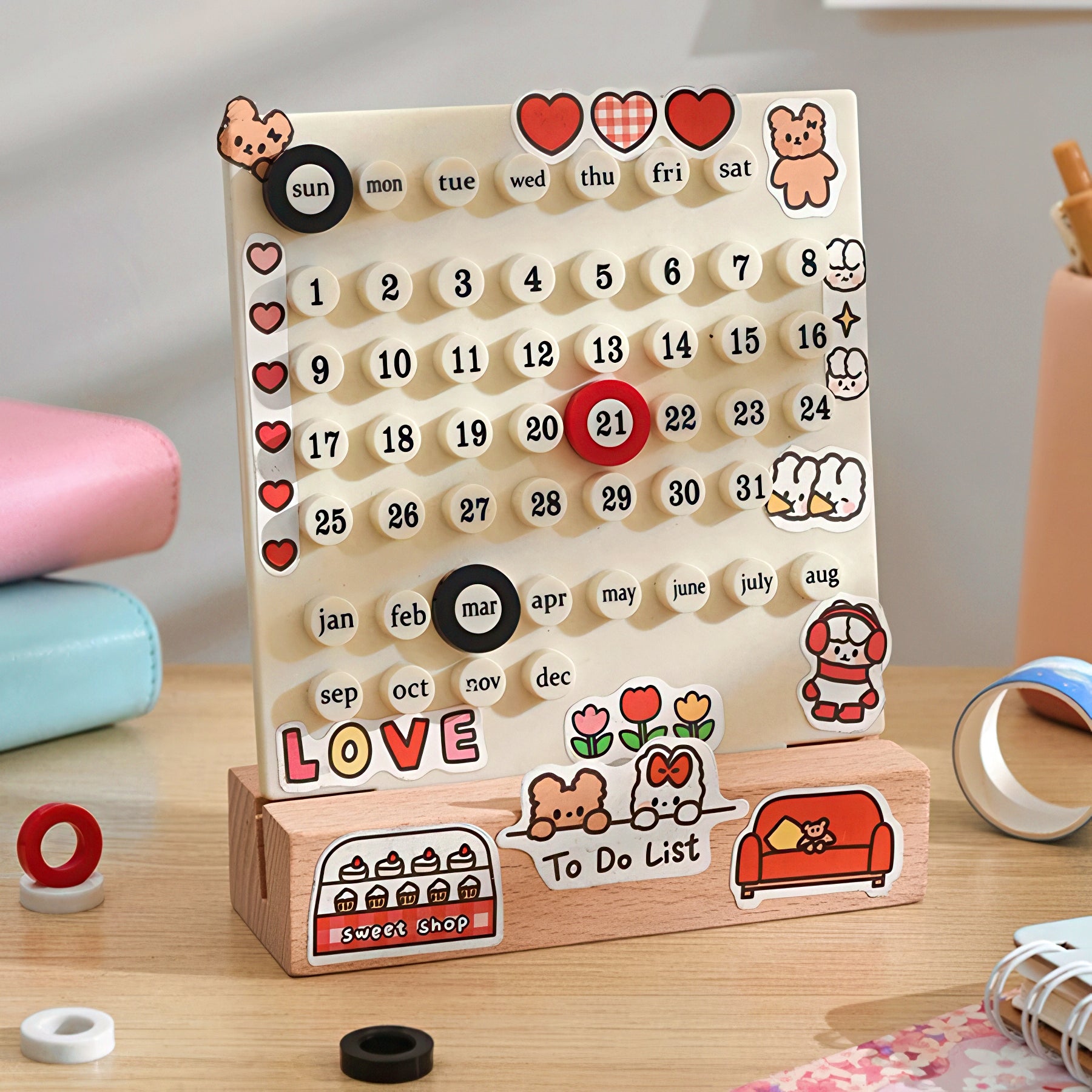 Wooden calendar with decorative elements on a wooden surface