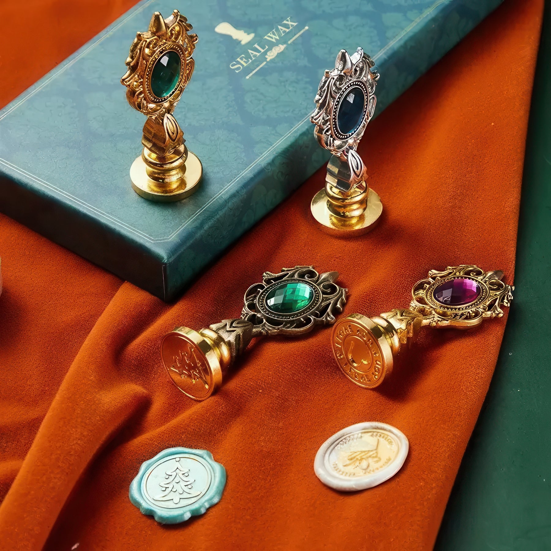 Decorative wax seals with gemstones on a textured surface