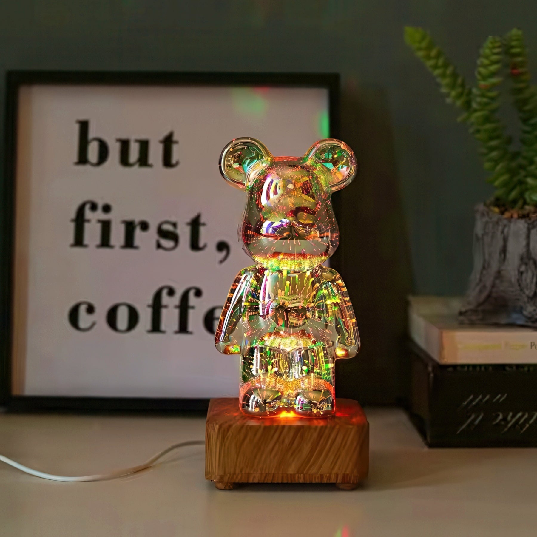 Colorful bear-shaped lamp on a wooden base with a blurred background