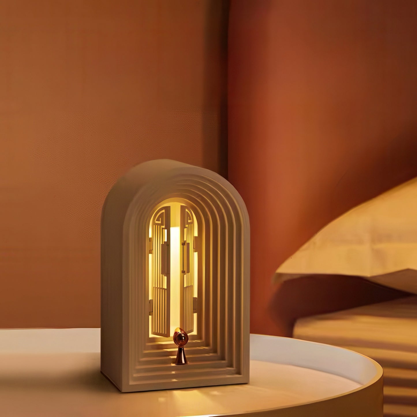 Decorative arch-shaped lamp with a warm glow on a brown background