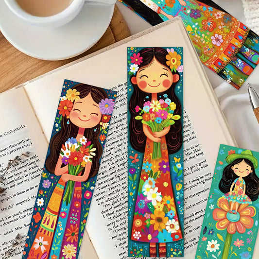 Colorful paper bookmarks with floral designs on a book.