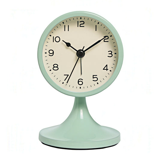 Mint green table clock with a beige face on a white background