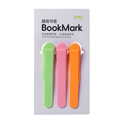 Three colorful bookmarks in green, pink, and orange on a white background