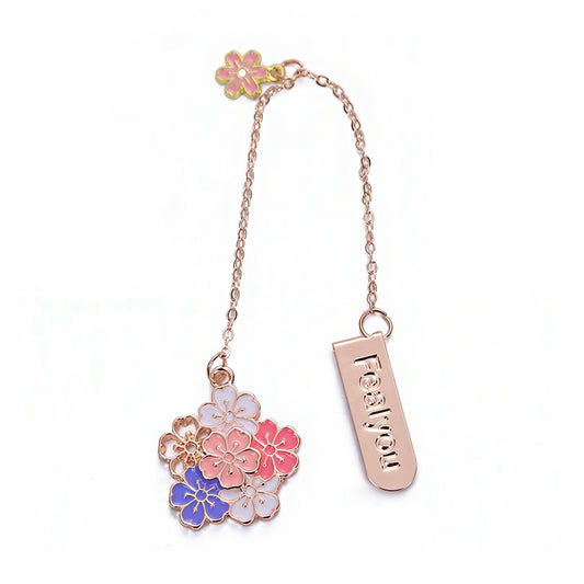 Decorative bookmark with floral designs and a chain on a white background