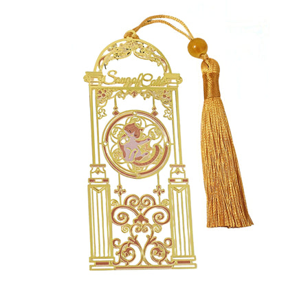 Cat themed golden metal bookmark with tassel on a white background