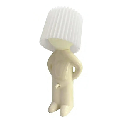 Cute little shy boy table lamp on a white background