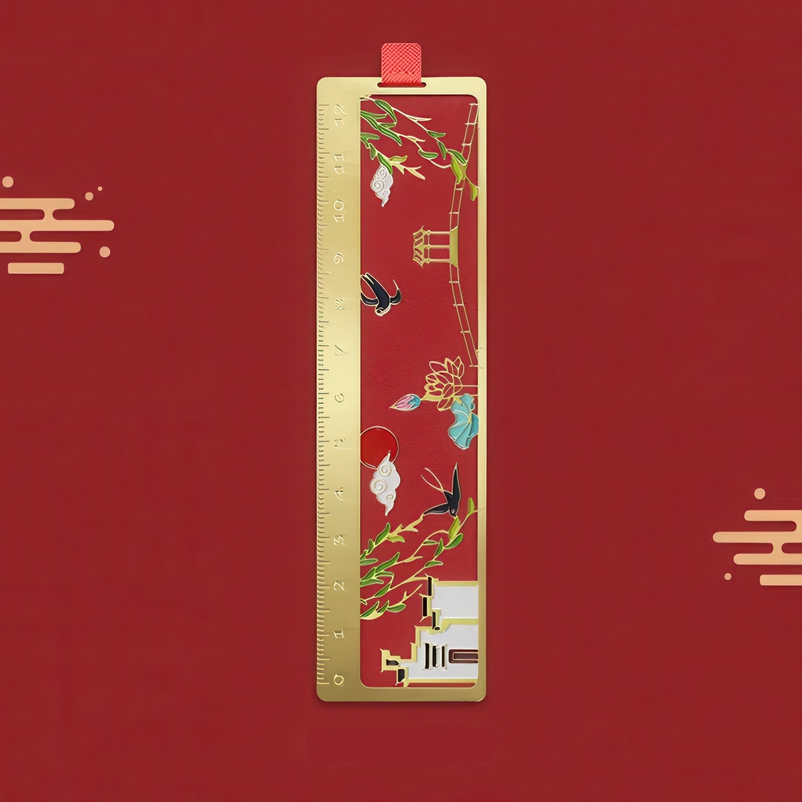 Gold bookmark with floral design on a red background