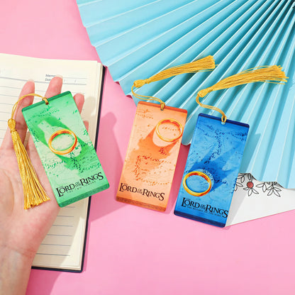 'The Lord of the Rings' themed acrylic bookmarks on a pink and blue background